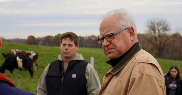 Tim Walz talks with farmers.