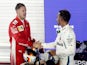 Lewis Hamilton shakes hands with Sebastian Vettel at the Singapore Grand Prix on September 16, 2018