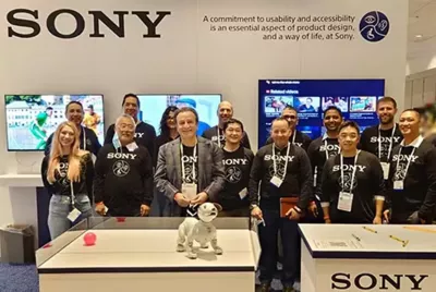 Group photograph posed by Sony team members at exhibition stand