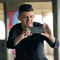 A person taking a photo with the Xperia 1 V