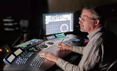 A person working in a studio on a production edit