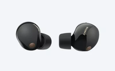 Truly wireless earbuds on grey background