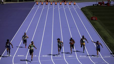 Athletes run on the track during a rehearsal at the Stade de France stadium on June 25, 2024, in Saint-Denis, outside Paris.