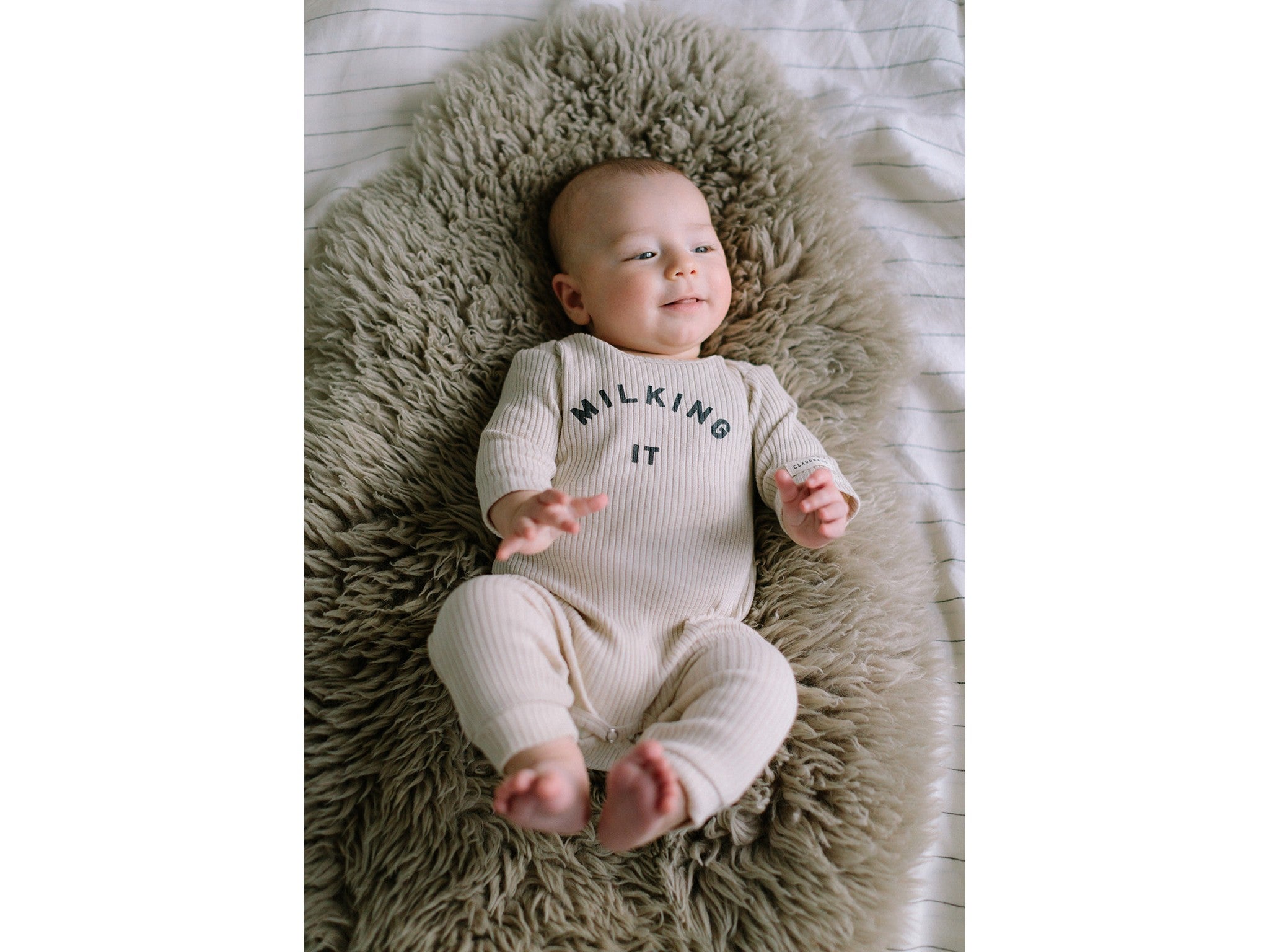 Claude & Co milk onesie  indybest