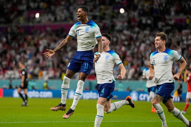 <p>Marcus Rashford celebrates opening the scoring against Wales </p>