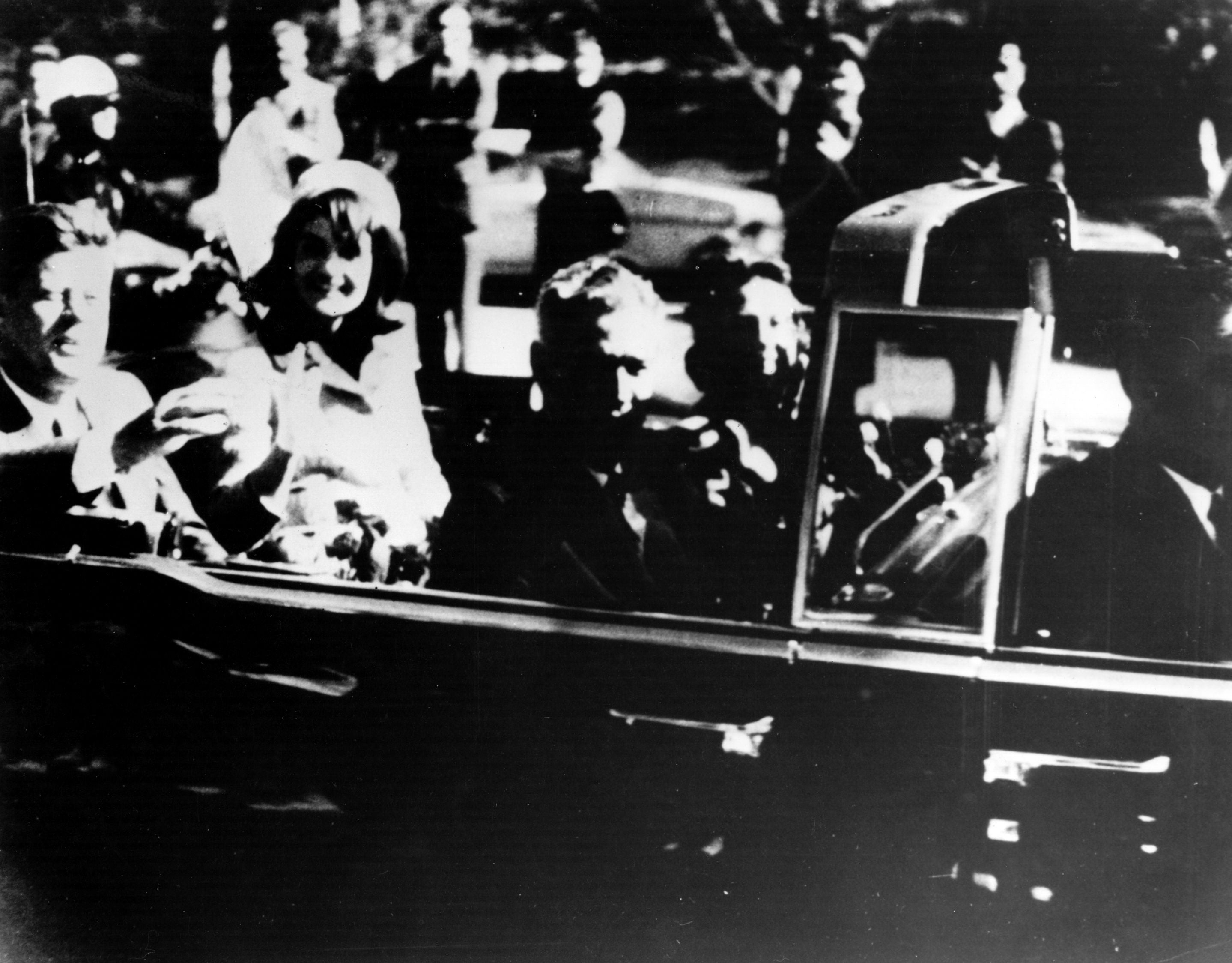 President John F Kennedy and first lady Jacqueline Kennedy in an open car motorcade shortly before the president was assassinated in Dallas, Texas