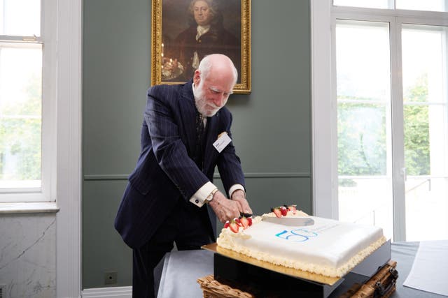 <p>Vint Cerf cuts a cake to celebrate 50 years of the internet</p>