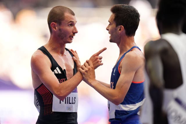 <p>Great Britain’s George Mills and France’s Hugo Hay argue following their men’s 5000 metres heat</p>