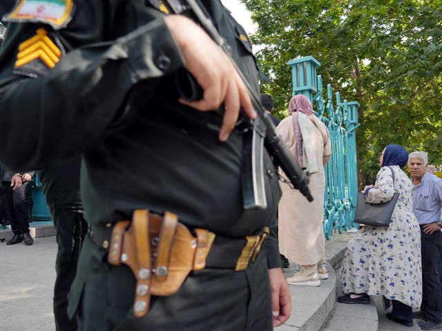 <p>File. A policeman stands guard outside a polling station during voting in Tehran for the Islamic republic’s presidential election on 28 June 2024</p>