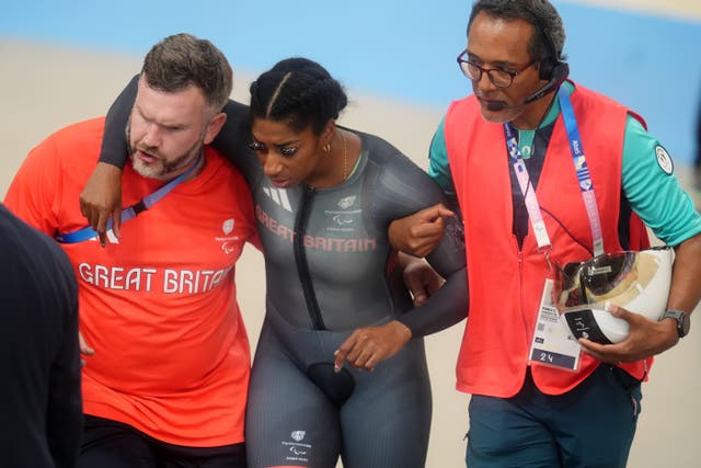 <p>Kadeena Cox was helped from the track (Adam Davy/PA)</p>