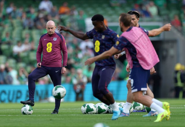 <p>Lee Carsley watches on as England’s players train before kick-off against Ireland</p>