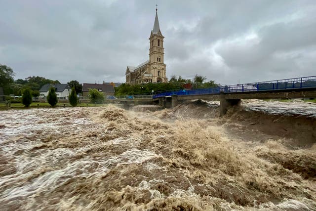 <p>A torrent of water flows along the river Bela in Mikulovice, Czech Republic, during heavy rain on Saturday </p>