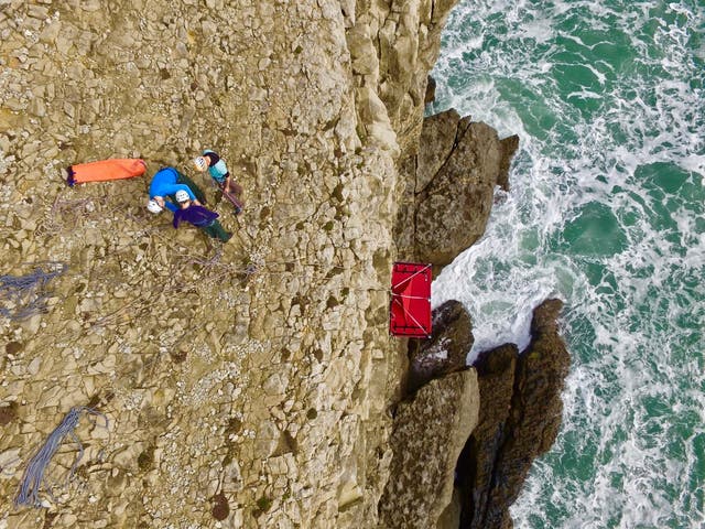 Cliff camping means sleeping over the edge of a drop