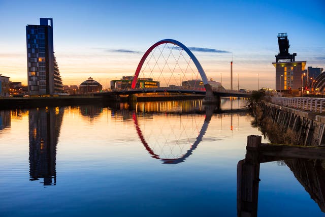 Evening view along the River Clyde from the city towards the Finnieston Bridge, with Pacific Quay and the Glasgow Science Centre tower beyond