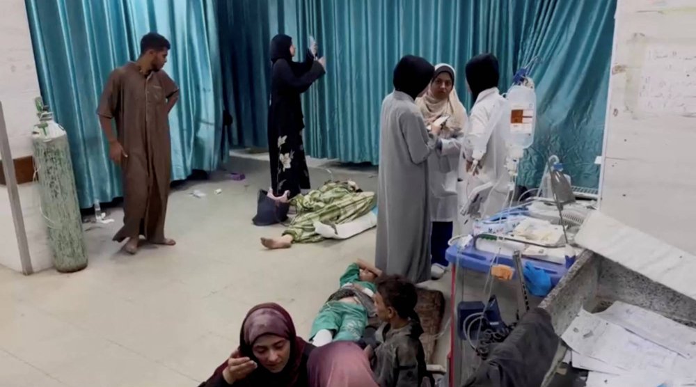 Palestinians wounded in Israeli strikes lie on the ground at Kamal Adwan hospital, amid the ongoing Israel-Hamas conflict, in Jabalia in the northern Gaza Strip in this still image taken from a video, October 20, 2024. Reuters TV via REUTERS