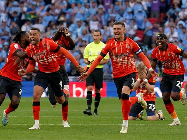 <p>Luton celebrate their dramatic play-off final win </p>