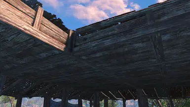 Shack ceilings with wood hiding the spindly rafters.