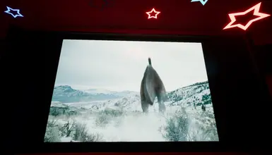 the theater in the daycare now plays a small part of the Jurassic world Dominion trailer