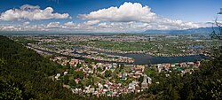 Panorama of city in green area near a river and lakes