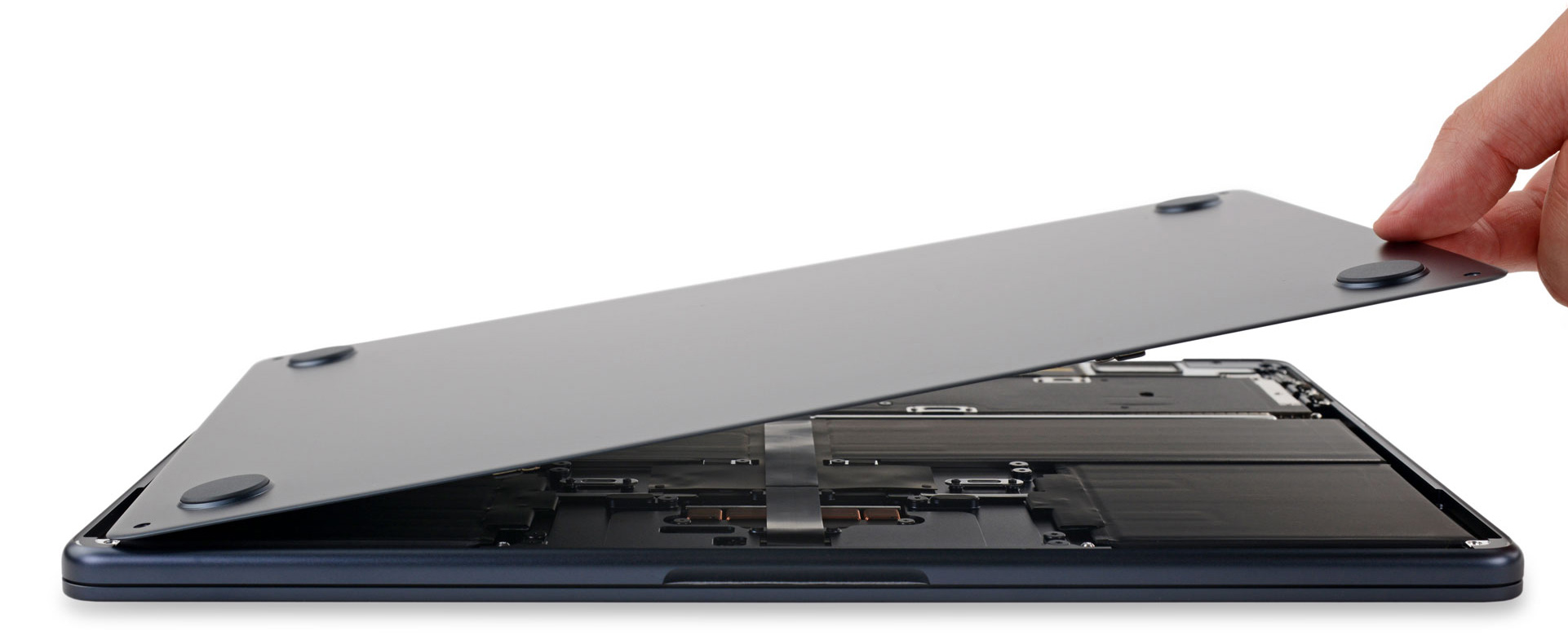 Lifting the lower cover of the M2 MacBook Air to partially reveal the internals