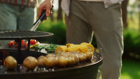 man hands pouring salt on bbq