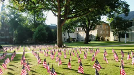 flags decorate lawn of moravian church and linden hall school in lititz pennsylvania during dramatic morning sunlight