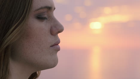 portrait of beautiful young woman enjoying peaceful seaside at sunset exploring spirituality contemplating future