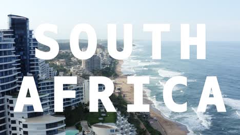 drone shot of coastline with ocean and beach resort overlaid with animated graphic spelling out south africa