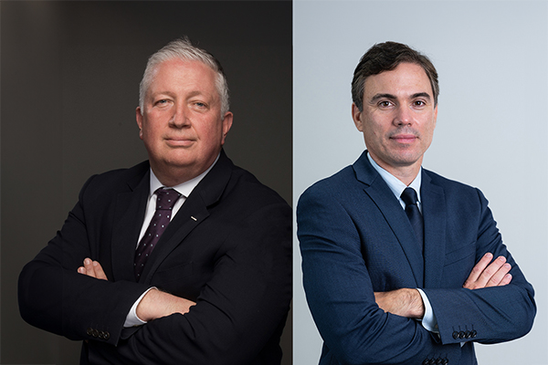 Collage of two executive headshots both wearing black suits, a slight smile, and their arms crossed.