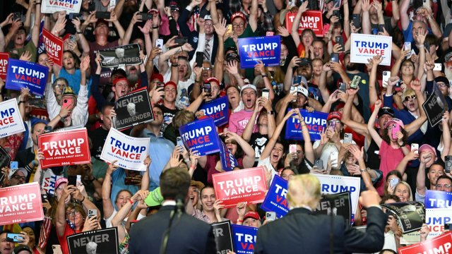 Article thumbnail: The crowd cheers as former US President and 2024 presidential nominee Donald Trump (R, bottom) with US Senator and vice presidential nominee J.D. Vance (L, bottom) attend their first campaign rally together at Van Andel Arena in Grand Rapids, Michigan, on July 20, 2024. (Photo by Jim WATSON / AFP) (Photo by JIM WATSON/AFP via Getty Images)