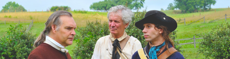 Photo showing recreated Patriot Militiamen of the American Revolution in various states of undress. John W. Penney. 2011.