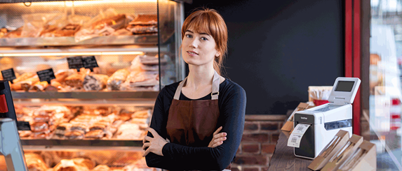 a deli employee using Brother's TD label printer