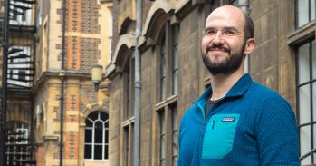 Dr Alex Cagan outside the Department of Genetics