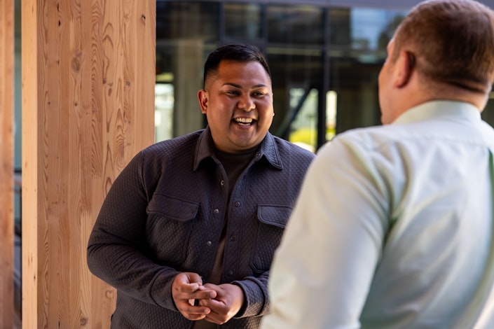 Two Ai2 team members talking.