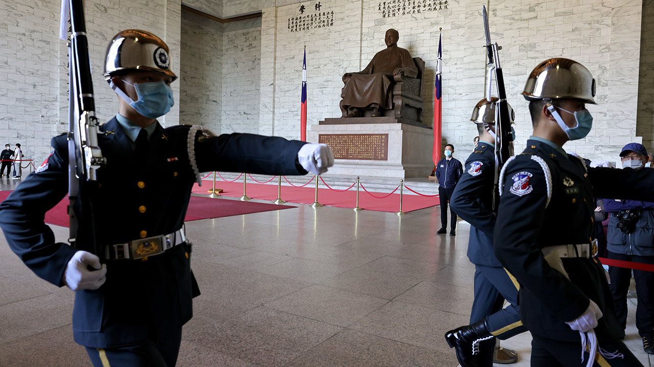 Guards march during the changing ceremony at Chiang Kai-shek Memorial Hall, in Taipei, Taiwan, February 12, 2023