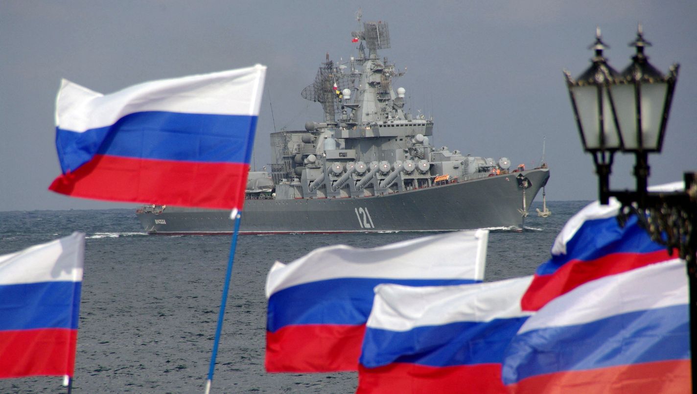 Pro-Russian supporters wave flags as they welcome missile cruiser Moskva entering Sevastopol Bay, 2008