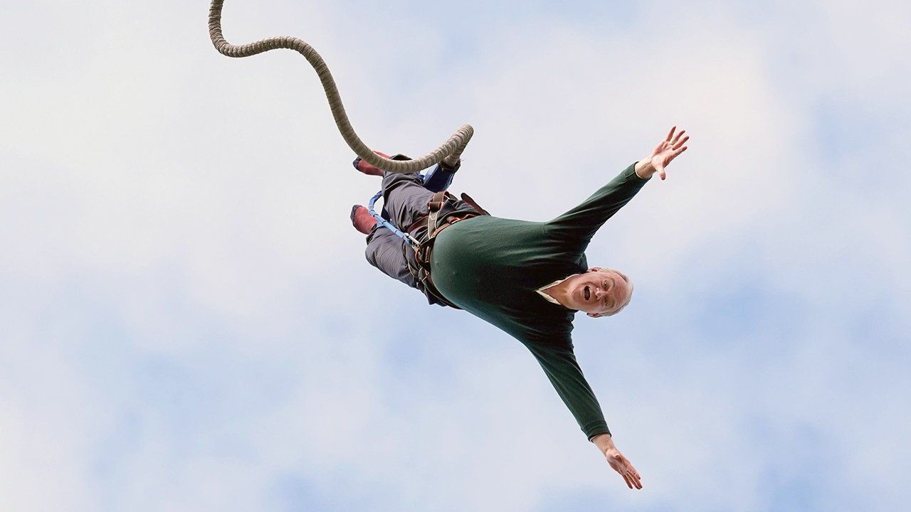 Liberal Democrat leader Sir Ed Davey taking part in a bungee jump.