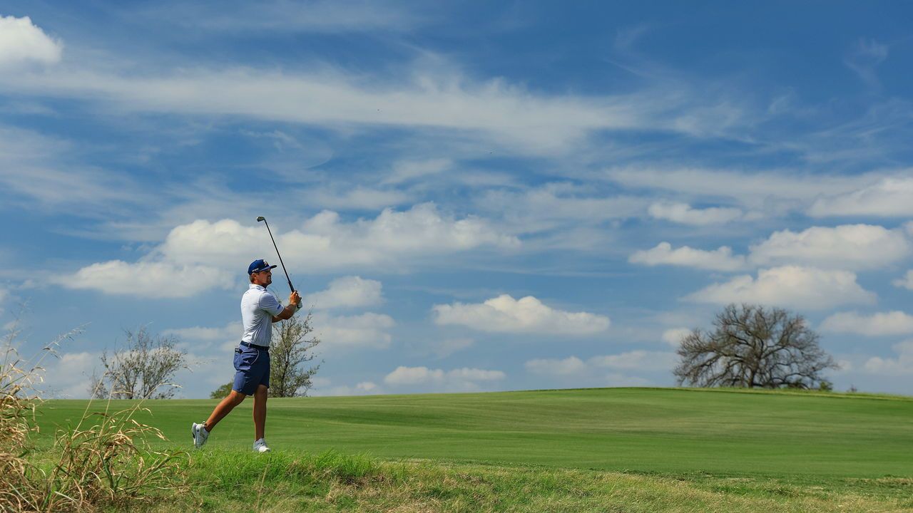 Bryson DeChambeau of The United States and The Crushers plays his second shot on the second hole.