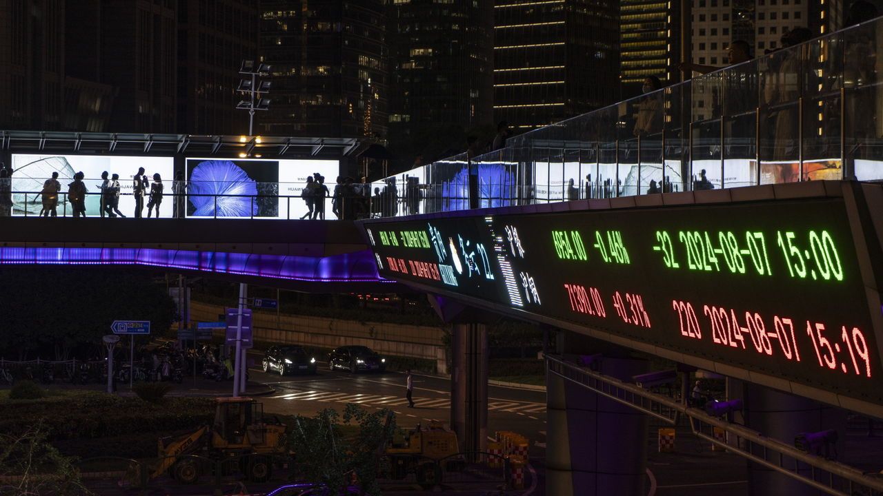 An electronic ticker displays stock figures in Shanghai, China, on August 7th 2024