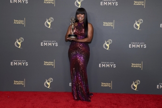 Angela Bassett poses with her Award backstage for Outstanding Narrator for Queens at the 76th Creative Arts Emmy Awards