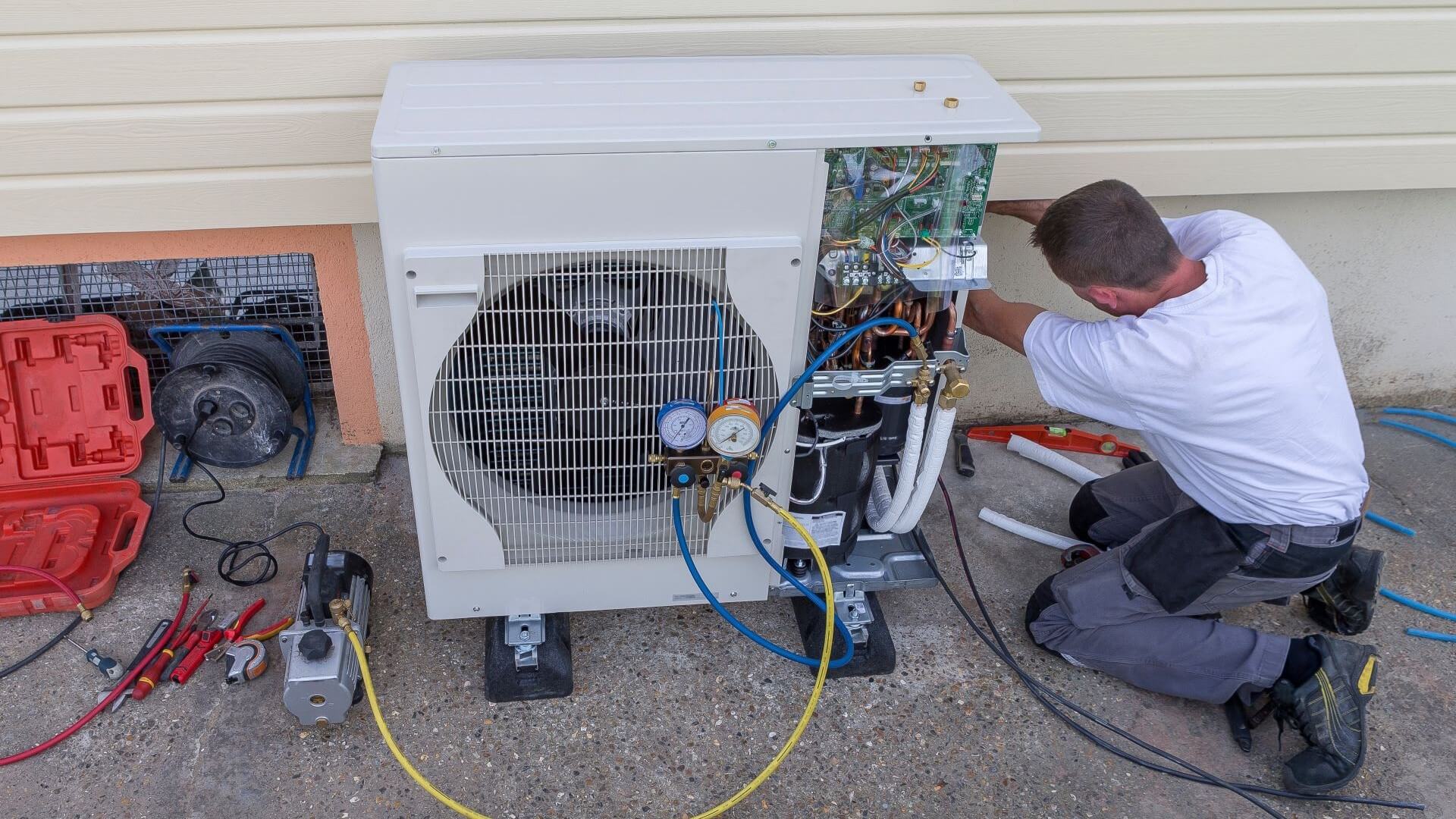 Engineer fixing a heat pump