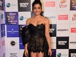 Rashmika Mandanna was among the most glamorous celebrities at the event in a black sheer outfit with a long train. She won an award for her debut Bollywood film Goodbye. (Varinder Chawla)