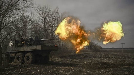 Ukrainian servicemen seen firing an S60 anti-aircraft gun at Russian positions near Bakhmut on March 20. The months-long battle for Bakhmut has become one of the bloodiest of Russia's nearly 13-month-old war in Ukraine. While it is uncertain whether either meeting would change the course of the war, the talks, about 800 kilometers apart, highlight the war’s repercussions for international diplomacy as countries line up behind rival parties. (Aris Messinis / AFP)