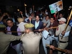 Congress leader Ghulam Ahmad Mir and others scuffle with police during party's 'Jai Bharat Satyagrah' torch rally, in Jammu, Monday.(PTI)