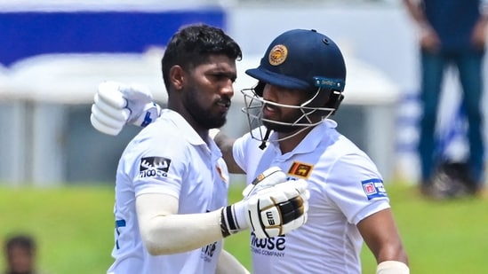 Sri Lanka's Nishan Madushka celebrates with his teammate Kusal Mendis (R) after scoring a double century (200 runs) during fourth day of the second and final cricket Test match between Sri Lanka and Ireland at the Galle International Cricket Stadium in Galle on April 27, 2023. (Photo by Ishara S. KODIKARA / AFP)(AFP)