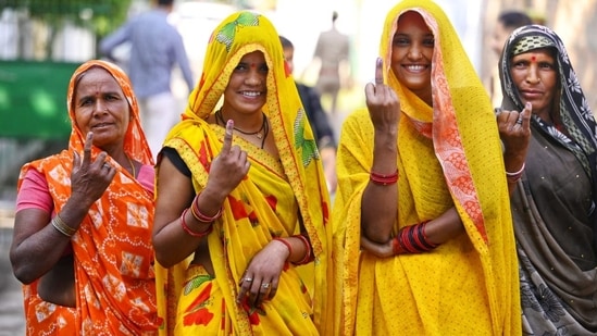 Women show inked finger after they cast their votes.(Deepak Gupta / Hindustan Times)
