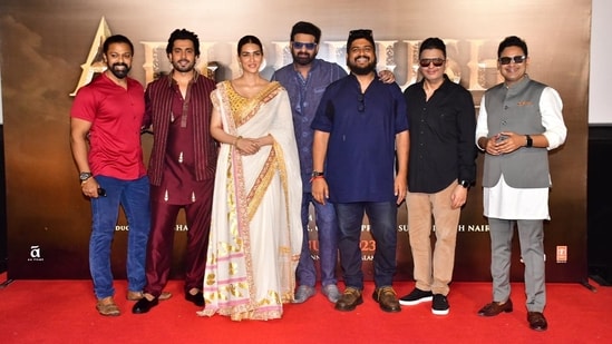 Kriti Sanon, Prabhas, Sunny Singh, and Bhushan Kumar among others attended the trailer launch event on Adipurush at the Juhu PVR in Mumbai. For the event, Kriti wore a white and golden saree, and Prabhas opted for a blue shirt and matching pants. Sunny was seen in a maroon outfit.