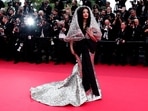 Aishwarya Rai, who usually serves multiple looks on her annual Cannes outing, walked the red carpet just once this year. She attended the screening of Indiana Jones and the Dial of Destiny in a silver Sophie Couture gown with a huge hood and a black bow at the waist. (REUTERS)