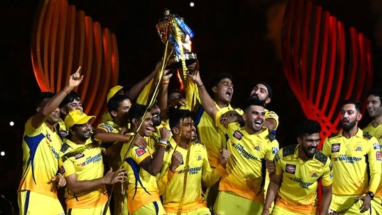 Chennai Super Kings players celebrate with the IPL trophy.(AFP)