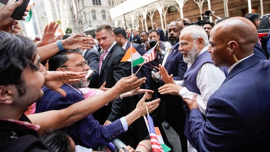 PM Modi in US: Narendra Modi greets supporters of the Indian community on the way to the Lotte New York Palace Hotel, his stay in New York.(AP)